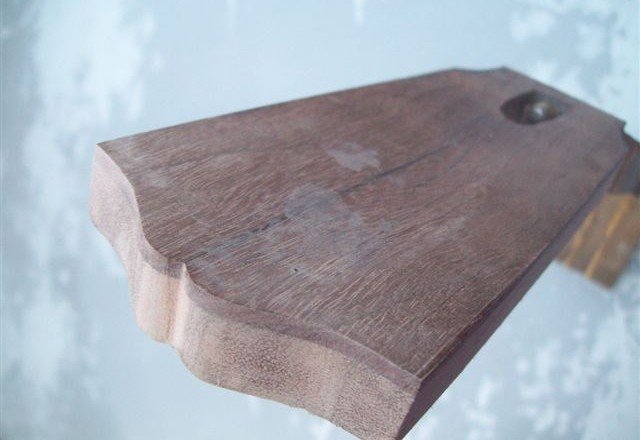 Fresh cut headstock woodgrain for broken neck repair.